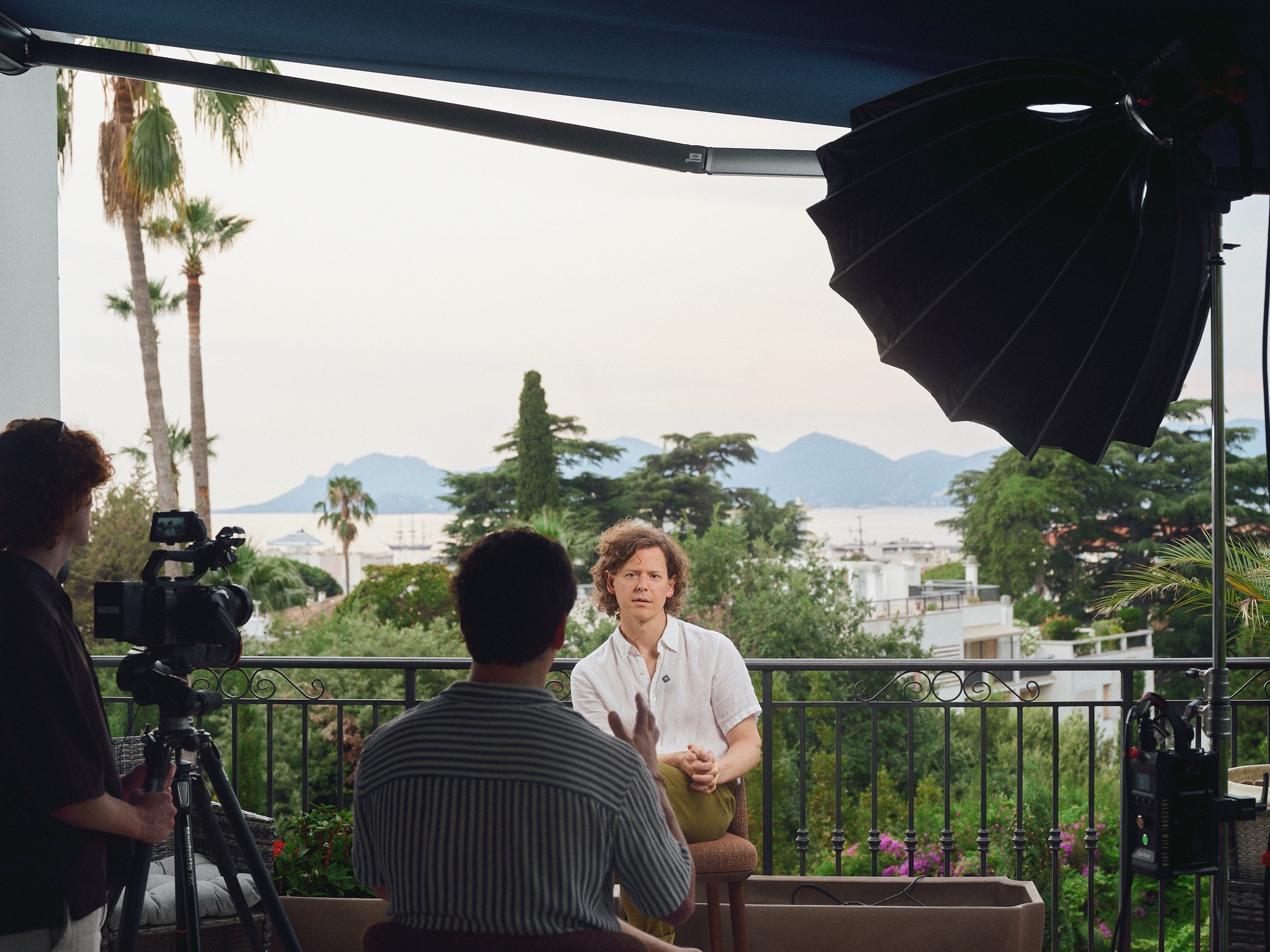 An interview being filmed on the COLLINS House terrace overlooking Cannes