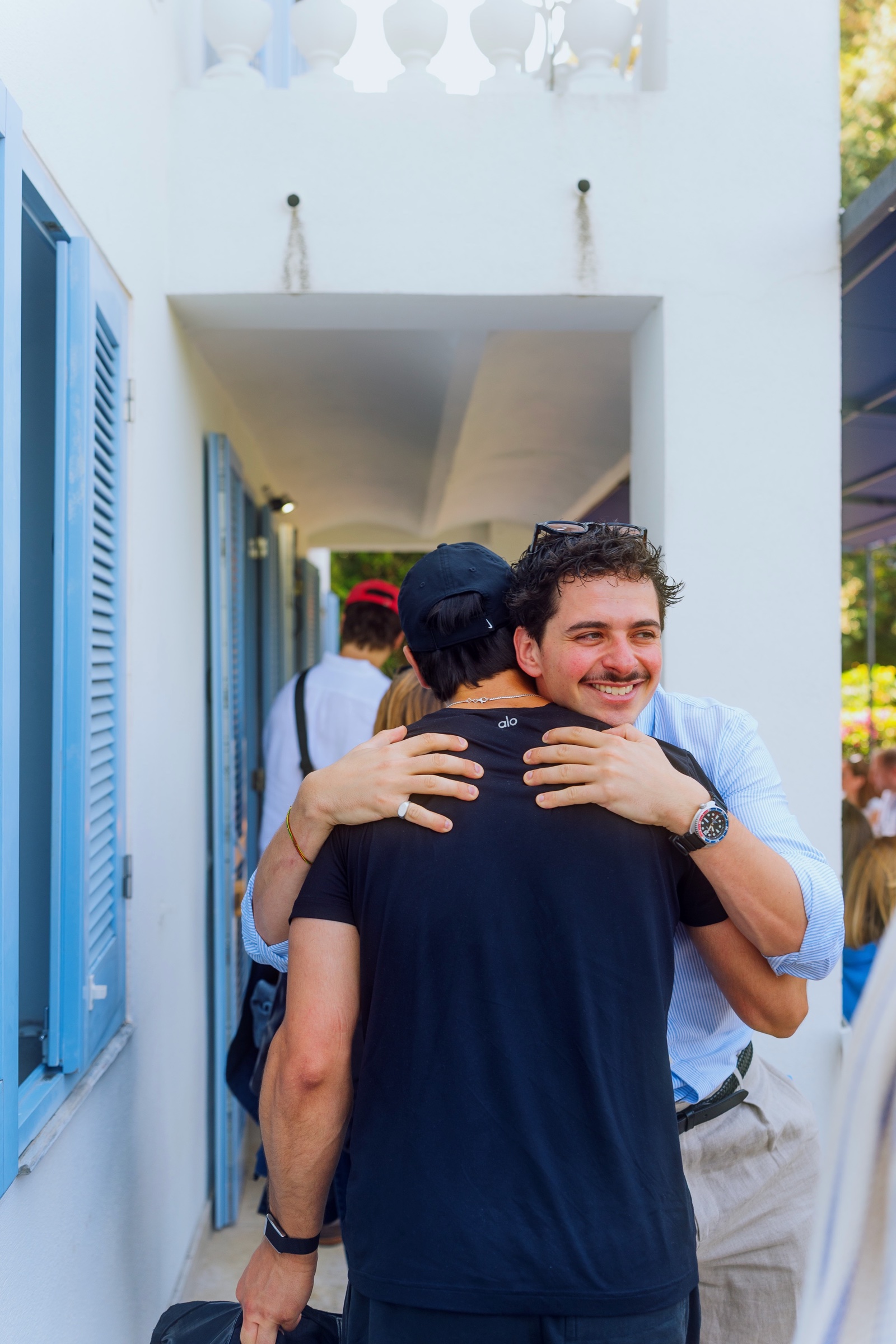 Guests greeting one another on the terrace