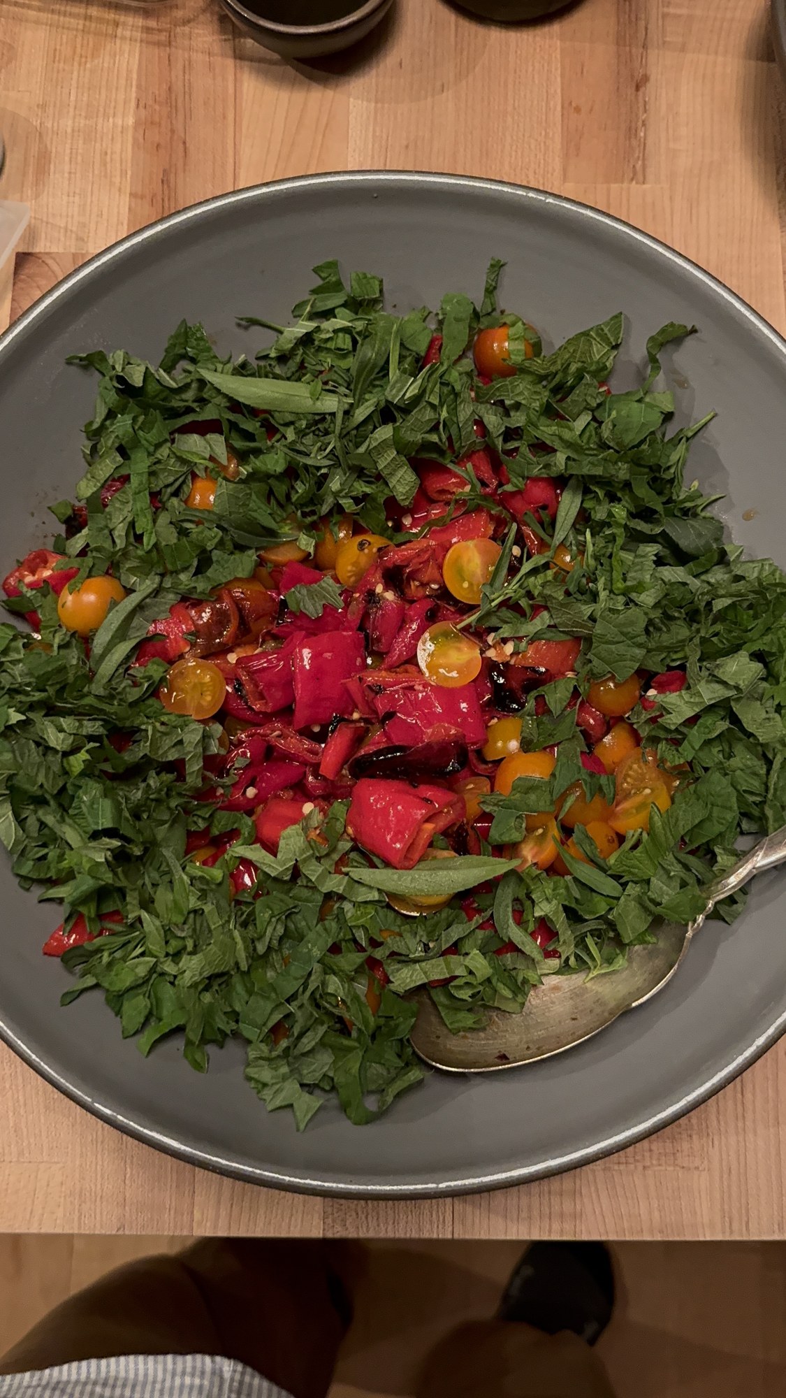 A colorful shared salad on the dinner table