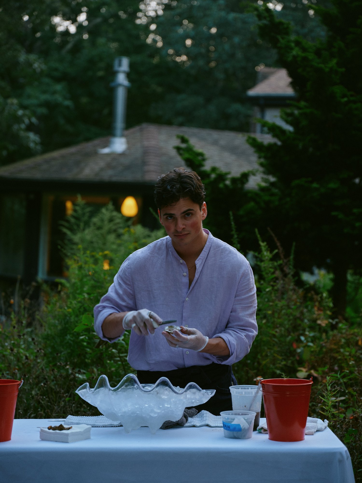 Eron preparing food at an outdoor table