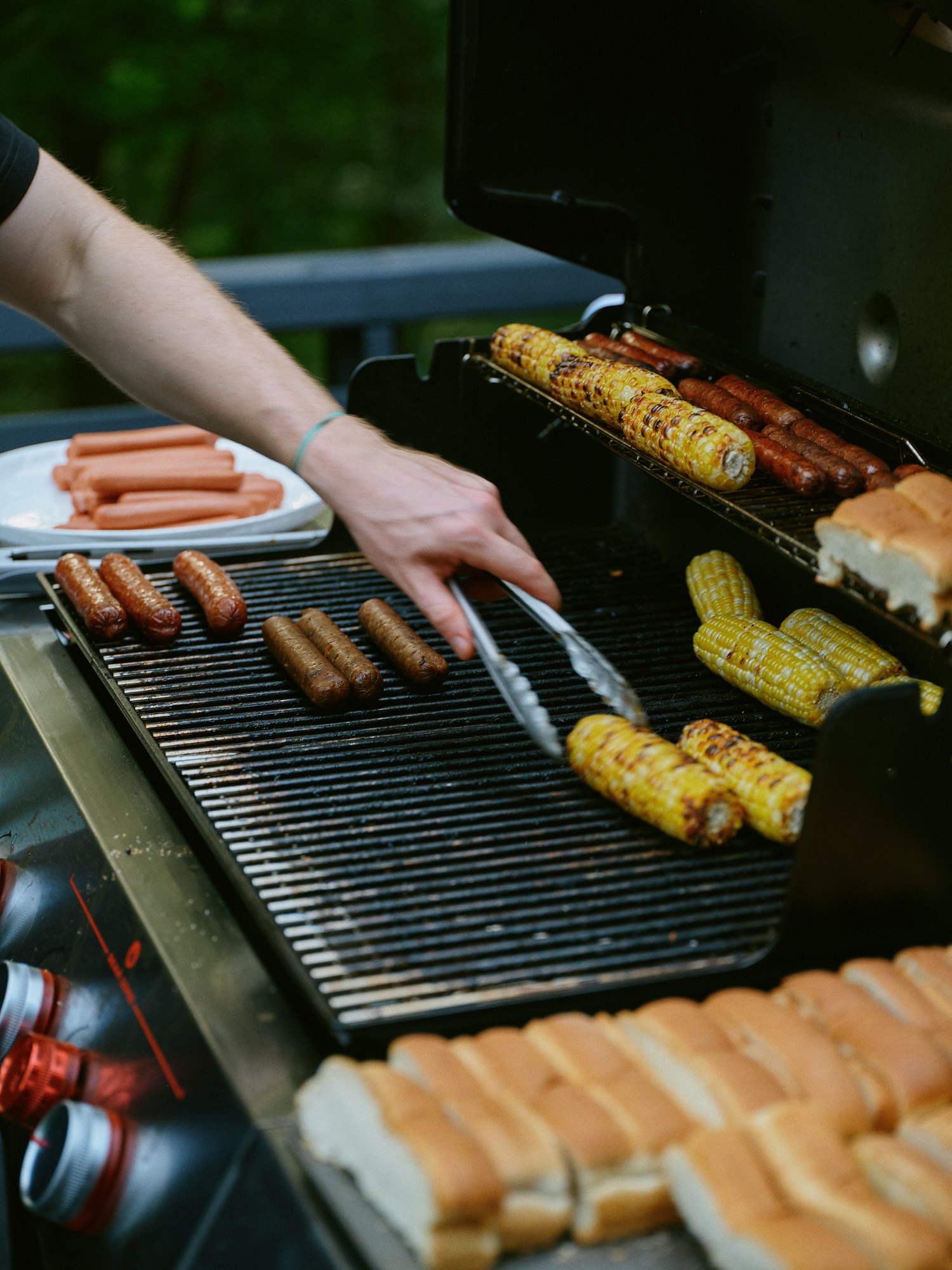 Corn and rolls cooking on the outdoor grill
