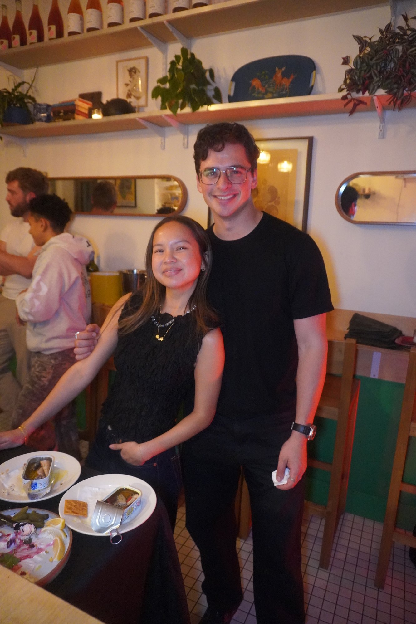 Two guests standing together at the dinner