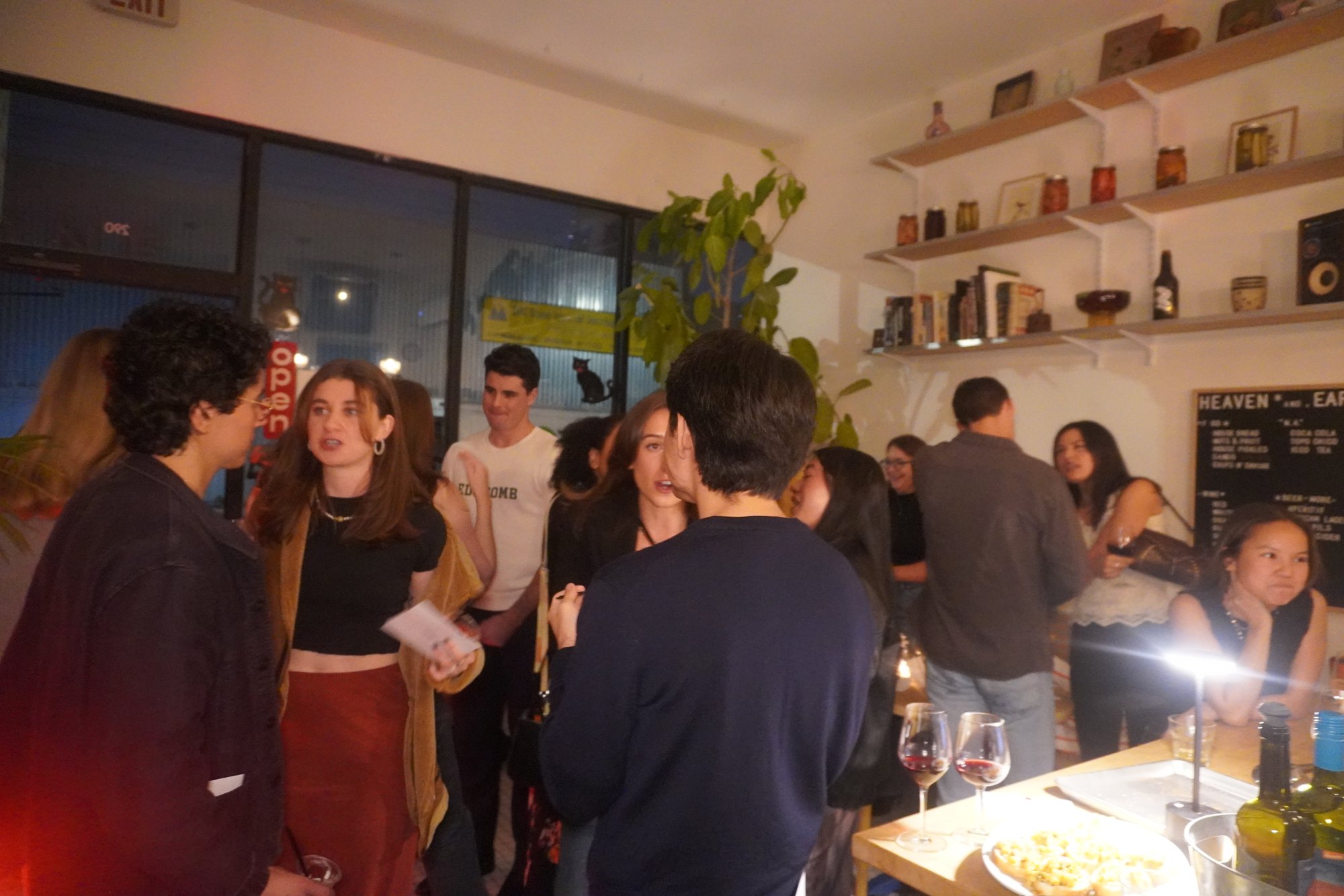Guests sharing food and conversation indoors