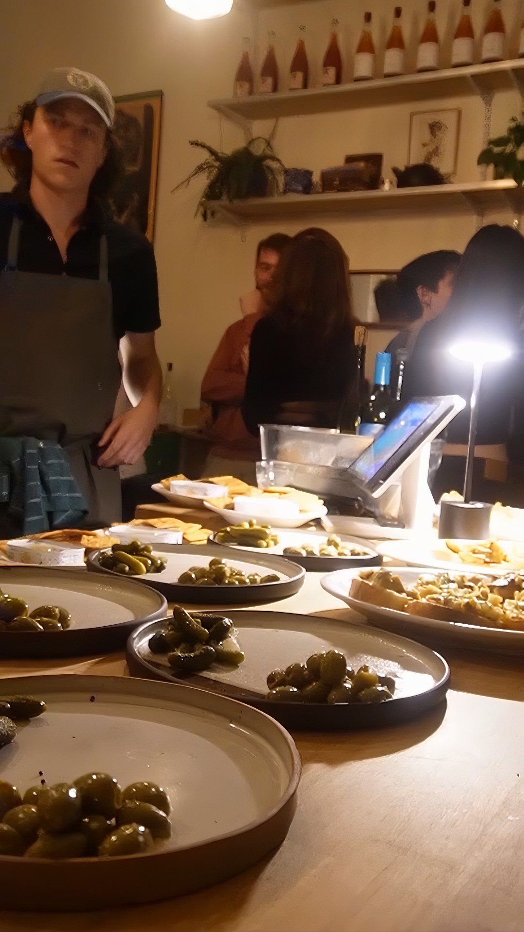 Dinner being served across a crowded table