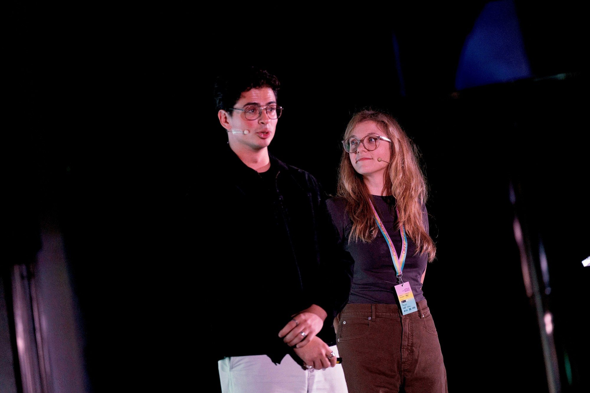 Eron and a co-presenter on stage at OFFF Sevilla