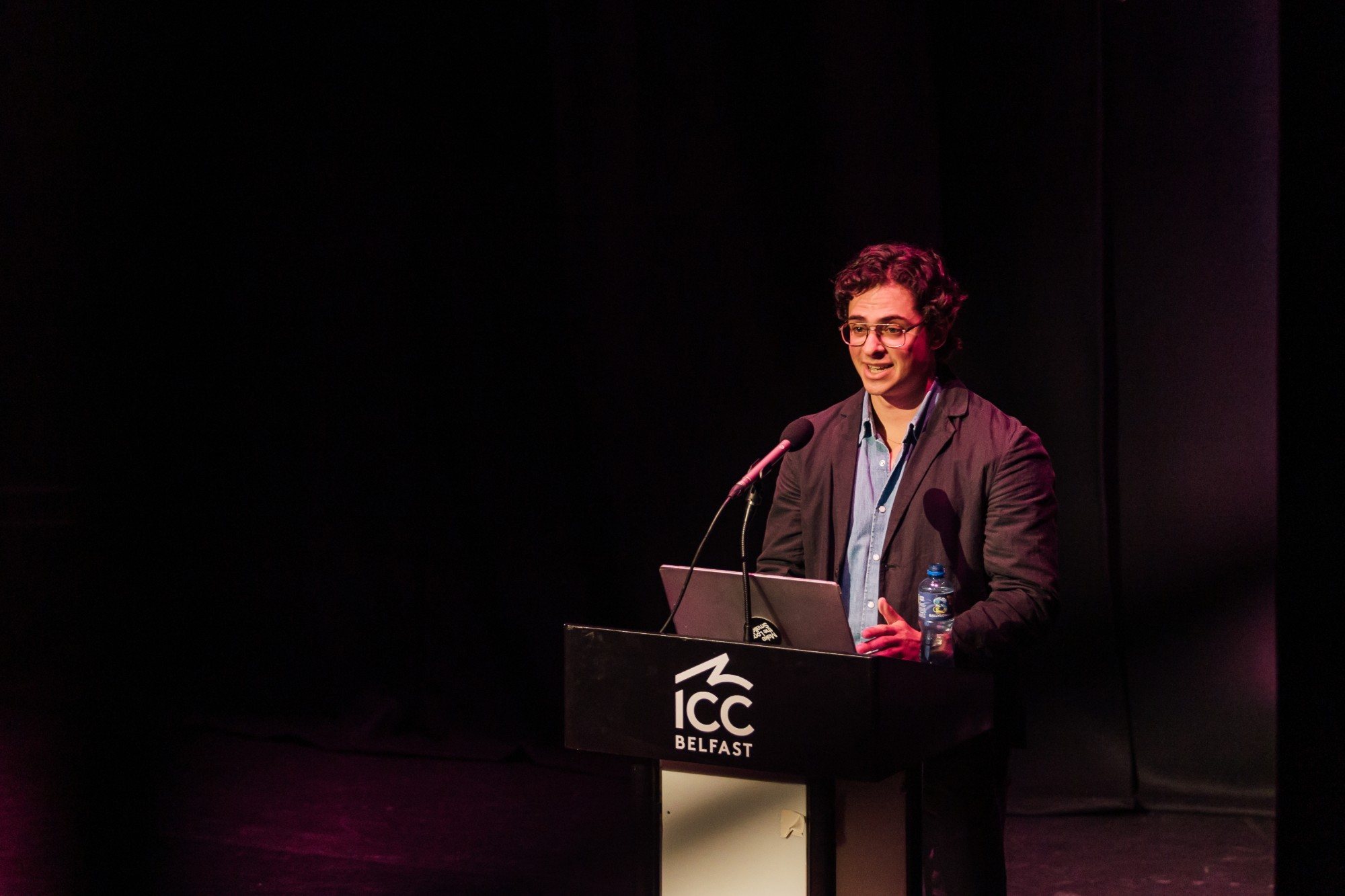 Eron speaking at the ICC Belfast podium