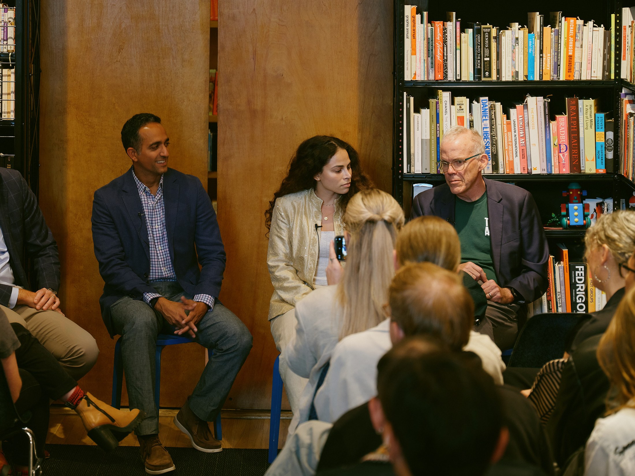 Panelists in conversation with the seated audience
