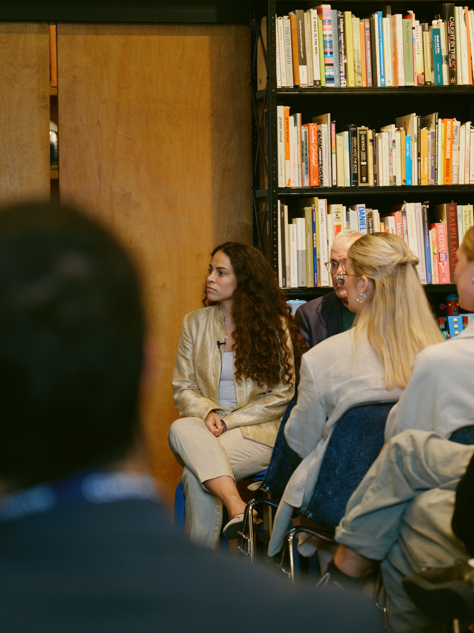 A panelist listening closely to the conversation